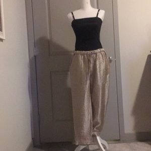 Gold track pants style pant.